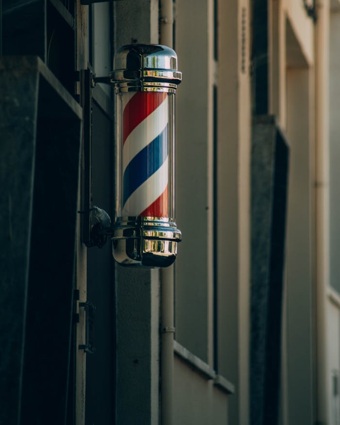 Traditional barber pole in Proença-a-Nova. Symbol of barbershop heritage.